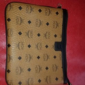 MCM cluth w a wrist strap.
